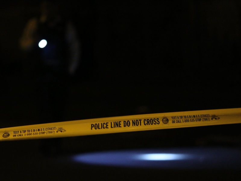 Police investigate the scene where a 22-year-old man was shot in the 7200 block of South Perry Avenue in Chicago on Saturday, April 19, 2014.